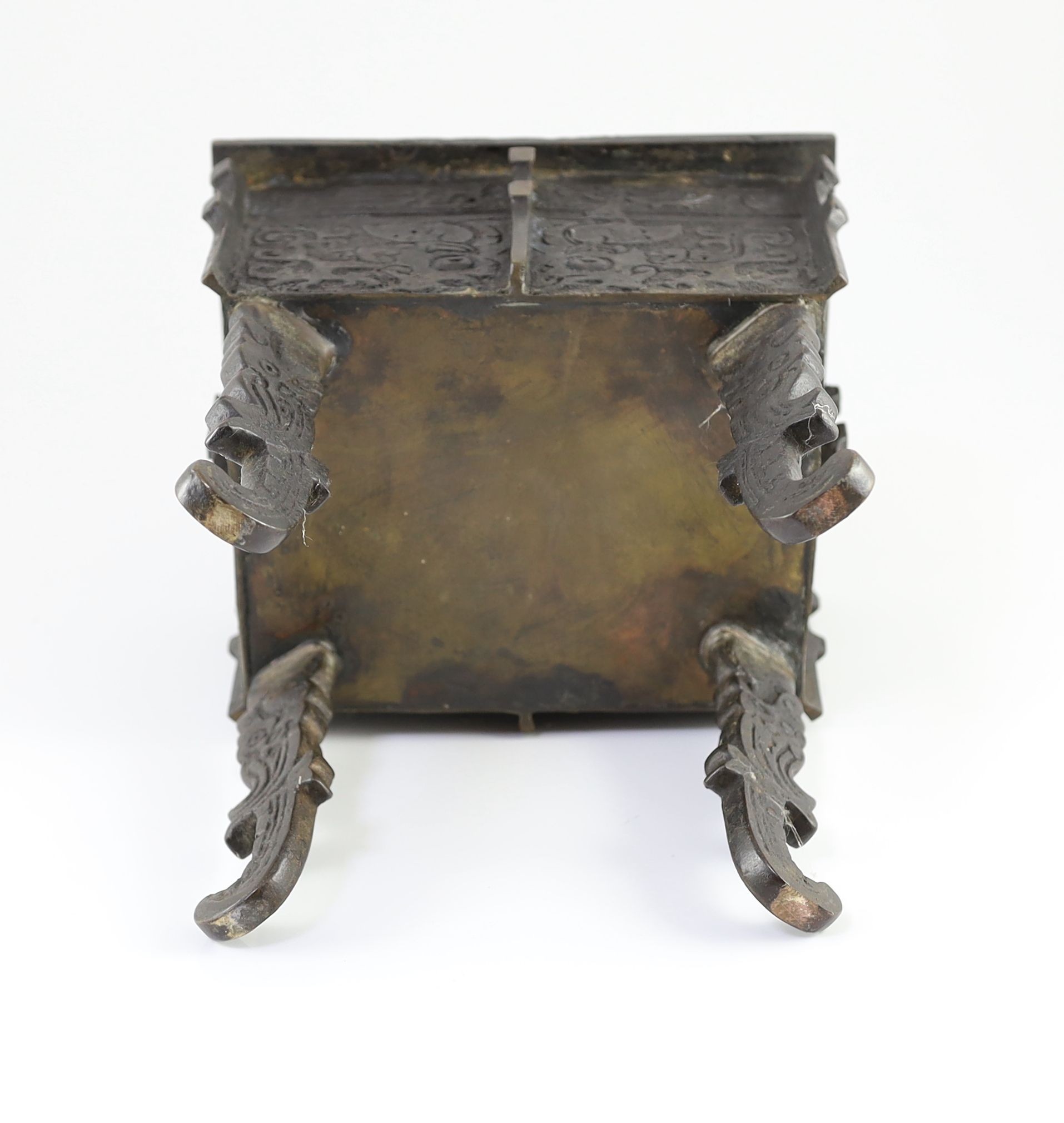 A Chinese archaistic bronze rectangular censer, fangding, 17th/18th century 34cm high, 24cm wide, 20cm depth later liner and repairs to legs
